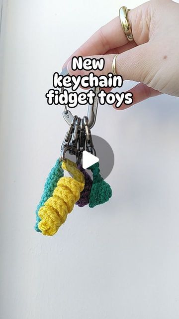 Loui Mitchell on Instagram: "🔑✨KEYCHAIN FIDGETS✨🔑

I've been making the Pushit keychain fidget for a while now, but I've been requested to make a variety of keychain fidgets, so here we are!

-Pushit (marble inside to push up and down)
-Twirlit (twisted yarn fun to stretch and twirl)
-Popit (similar to a mini dimple)
-Squishit (like a stress ball, mine is filled with popcorn kernels!) 

TESTER CALL OUT NOW, PATTERNS AVAILABLE SOON! 😅

#crochet #fidgettoy #marblepusher #pushit #twirlit #popit #minidimple #squishit #stressball #keychain" Fidget Keychain Diy, Diy Fidget Keychain, Crochet Fidget Keychain Free Pattern, Crochet Marble Fidget, Keychain Fidgets, Crochet Fidget, Popcorn Kernels, Crochet Keychain, Diy Keychain