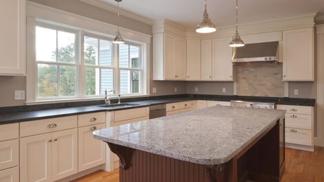 Who says everything has to match? When it comes to the kitchen, mismatched countertops are gaining momentum. Cheap Granite Countertops, Cost Of Granite Countertops, Installing Granite Countertops, Countertop Slabs, Off White Kitchens, Black Granite Countertops, White Subway Tile Backsplash, How To Install Countertops, Timeless Kitchen