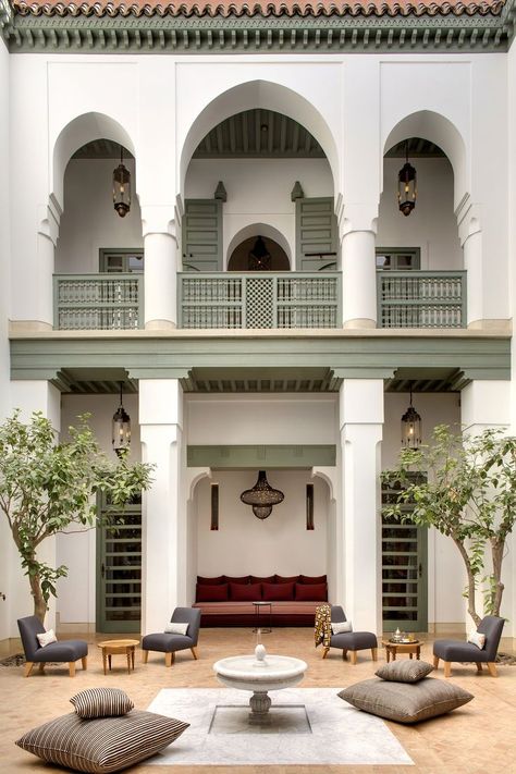 Arches and columns with fountain in the courtyard at Riad Azca, in Marrakech, Morroco #lecollectionist #luxuryhomes #homedesign #homeexterior #houseexterior #moroccaninteriors #moroccandecor Moroccan Hammam, Moroccan Riad, Riad Marrakech, Classic House Exterior, Sun Loungers, House Design Exterior, التصميم الخارجي للمنزل, Marrakech Morocco, Patio Interior