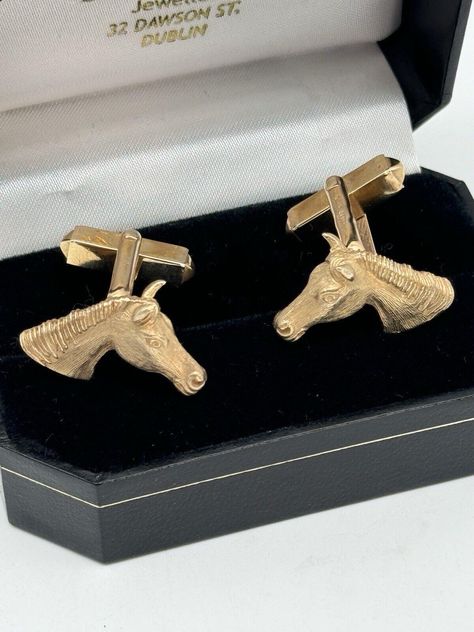 These vintage cufflinks are a rare find for collectors of Irish hallmarked jewelry. The intricate design features a horse head, making them a unique addition to any collection. Crafted from 375 9kt gold, they are of high quality and sure to impress. The T-bar style and design make them suitable for any occasion and the 11.4g total carat weight adds to their overall value. The brand appears to be signed DNM with a slightly Unclear Mark. Well made and of excellent craftsmanship. Don't miss out on the chance to own a piece of Irish jewelry history. Condition In beautiful antique age typical condition with mild signs of age appropriate use. Shows some mild age typical wear. Please review photos to form your own opinion. Dimensions Please refer to photos. All photos are to be viewed as an exten Jewelry History, Gold Horse, Irish Jewelry, Bar Styling, Vintage Cufflinks, Horse Head, Intricate Design, Gift Accessories, A Horse