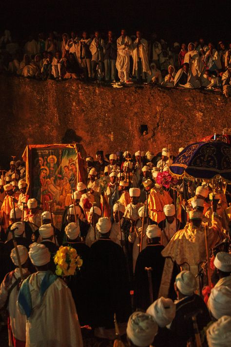 Ethiopian Orthodox Christmas, known as *Genna*, is celebrated with profound devotion in Lalibela, Ethiopia. Pilgrims gather in this holy city, famous for its rock-hewn churches, to participate in all-night prayers, hymns, and liturgical services. The celebration is marked by traditional chants, candlelight processions, and a deep sense of spiritual reverence, creating a truly awe-inspiring atmosphere. #Orthodoxtewahdo #Orthodoxchristmas #Sacredlalibela