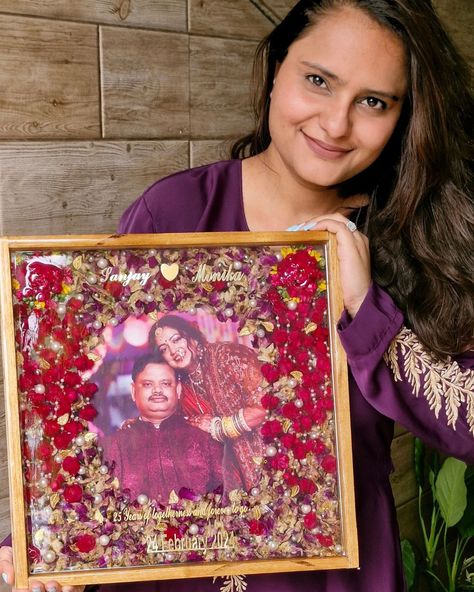 I am delighted to share this beautiful teakwood frame preserved with a vibrant pair of kaleeras and a varmala. It was created as a 25th-anniversary gift from a daughter to her parents, and I am thrilled to report that they were overjoyed with the result.✨️🧿 The feedback from the client was incredibly positive, and it brought me immense joy to know that my creation was so well-received. Both the daughter and her parents expressed their love for the frame, and I am proud to have been a part of... Flowers Varmala, Wedding Preservation, 25th Anniversary Gift, Parents Anniversary, A Daughter, The Client, How To Preserve Flowers, Parent Gifts, 25th Anniversary