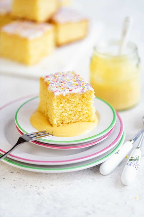 This old fashioned school cake topped with a simple glaze and sprinkles is just the simple retro bake we all need right now! Easy to make all in one bowl and delicious served plain or with warm vanilla custard. Cake And Custard, Milk Cakes, Easy Bake Cake, Berry Cheesecake Recipes, Cake With Icing, Rum Punch Recipes, School Dinner, School Cake, Lemon Drizzle Cake