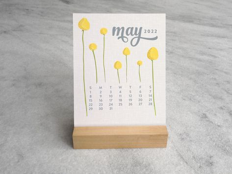 "Original illustrations of botanicals and flowers adorn this 12-month desk calendar. ✤ 4.25\" x 5.5\" cards ✤ printed on sturdy, 120lb. cardstock ✤ maple wood stand ✤ packaged in a clear, protective cellophane sleeve ✤ made in USA See the entire Wildflowers collection here: https://etsy.me/2N6wE4l ©2015-2021 Favorite Story" Desk Calendar Stand, Boxed Holiday Cards, Mini Desk Calendar, Floral Calendar, Table Calendar, 2025 Calendar, Notecard Set, Desk Calendar, Custom Stationery