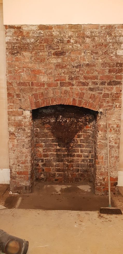 taking off years of plaster to reveal 100year old brick fireplace. Brick Fake Fireplace, Russian Fireplace, Old Brick Fireplace, Old Fireplace Ideas, Corner Brick Fireplaces, Brick Chimney Breast, Brick Fireplace Mantles, Exposed Brick Fireplaces, Brick Wall Bedroom