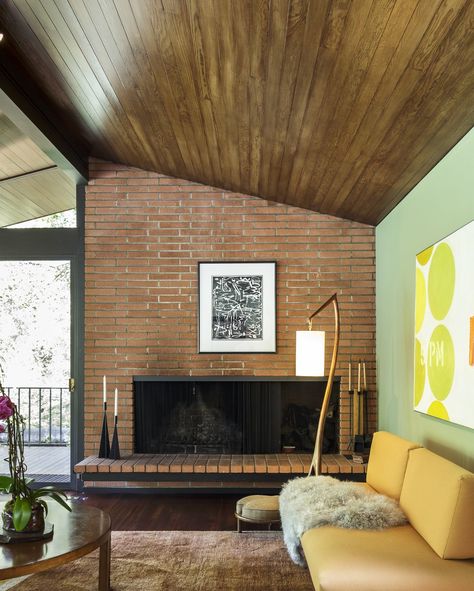 Dwell - A Southern Californian Midcentury With Japanese Influences Asks $3.13M Fireplace Sofa, Woodburning Fireplace, Floor Wood, Modern Homes For Sale, Brick Interior, Floor Lighting, Mcm House, Hardwood Floors Dark, Dark Hardwood