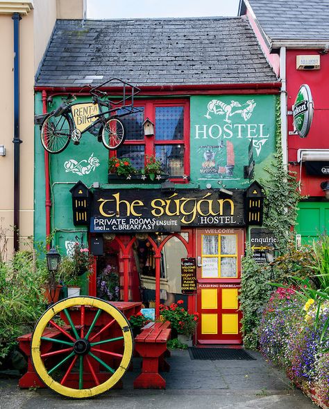 A colorful house serves as a hostel in Killarney, County Kerry, Ireland. Please note that an unauthorized copy of this photo is being offered for sale on a website in Ireland at http://www.macsfieldimages.com/landscape--heritage.html. Please do not buy it there. Killarney Ireland, Killarney, Shop Fronts, Ireland Travel, Christmas Village, Oh The Places Youll Go, Cafe Bar, The Doors, Guinness