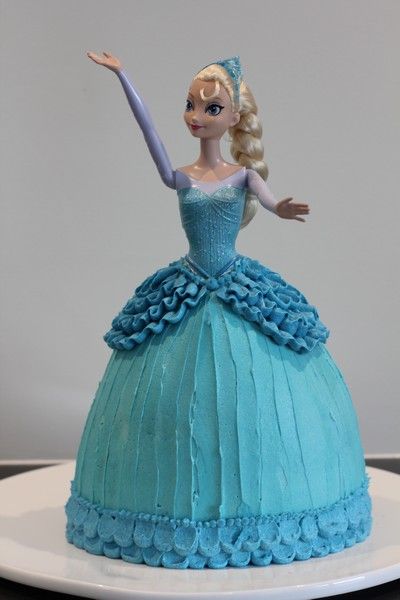 Elsa Cake (Buttercream tutorial) and an Ice-themed Birthday Party « Leave Room for Dessert Frozen Elsa Doll Cake, Doll Cake Tutorial, Frozen Doll Cake, Elsa Doll Cake, Elsa Torte, Frozen Elsa Doll, Pop Cakes, Elsa Cakes, Barbie Doll Cakes