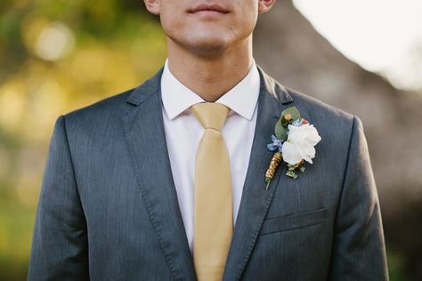 groom boutonniere  charcoal suit gold tie Gray Suit Gold Tie, Grey Suit Gold Tie, Suit With Gold Tie, Groomsmen Attire Grey, Outdoor Engagement Party, Dark Grey Suit, Grey Tux, Dark Gray Suit, Charcoal Gray Suit