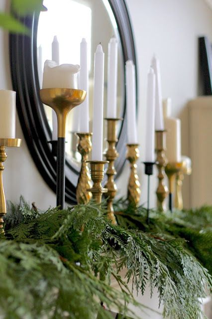 Fireplace With Candlesticks, Candlestick Collection Display, Mantle Decor Holiday, Styling Brass Candlesticks, Christmas Brass Candlesticks, Candlesticks On Fireplace Mantle, Candlestick Mantle Decor, Brass Candlesticks Decor Living Rooms, Decorating With Brass Candlesticks