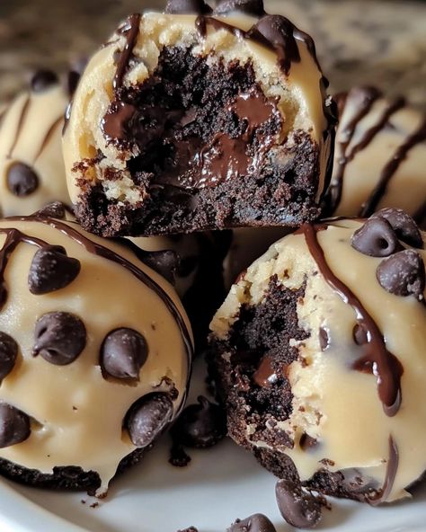 Chocolate Chip Cookie Dough Brownie Bombs 🍫🍪 Ingredients: - 1 box brownie mix (plus ingredients required for baking) - 1 cup all-purpose flour - ½ cup unsalted butter, softened - ½ cup brown sugar - ¼ cup granulated sugar - 2 teaspoons vanilla extract - 1 cup mini chocolate chips - 1 cup chocolate melting wafers Instructions: 1. Preheat the oven and prepare a baking dish according to brownie mix instructions. 2. Prepare the brownie batter as directed on the box and pour half into the bakin... Desert Food, Chocolate Melting, Breakfast Recipes Easy Quick, Dessert Cups Recipes, Chocolate Melting Wafers, Mini Brownies, Chocolate Dishes, Brownie Batter, Delicious Donuts