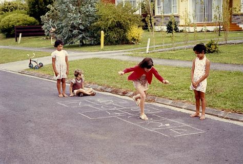 Girls playing hopscotch, around 1970 Suburban Street, Riding Bike, Sustainable Community, Backyard Playground, Old Street, Ap Art, Girls Play, Human Condition, Cute Wallpaper Backgrounds