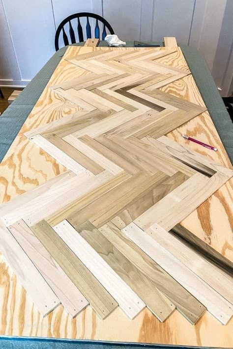 Learn how to create this DIY Herringbone Headboard which is a dupe for the expensive Hensley Reclaimed bed from Pottery Barn.