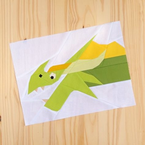 Look who's back! 🐲 Our mischievous little dragon friend has returned for round two. Meet Dragon II, the latest addition to our menagerie of mythical quilt blocks. I had so much fun designing this playful pattern! Will you make him in shades of green like mine? Or give him a rainbow of colors? Tag me so I can admire your handiwork. Happy quilting, friends! #foundationpiecingpattern #foundationpiecing #paperpiecing #paperpiecesprojects #paperpiecingdesign #foundationpaperpiecingpattern #found... Friendly Dragon, Dragon Quilt, Look Whos Back, Foundation Paper Piecing Patterns, Cute Sewing Projects, Round Two, Foundation Piecing, Quilt Block Pattern, Little Dragon