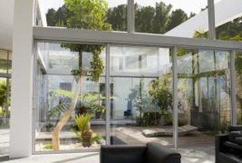 How to Decorate an Atrium | Home Guides | SF Gate Indoor Atrium, Atrium House, Solar Windows, Large Greenhouse, High Windows, Open House Plans, Cube Table, Two Story Foyer, Reptile Habitat