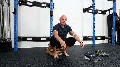 Learn how to use a slant board for improved mobility. Check out Dr. Kelly Starrett’s techniques, tips, and proper usage instructions. Benefits Of Squats, Slant Board, Lifting Shoes, Ankle Mobility, Calf Stretches, Squat Challenge, Olympic Lifting, Long Term Goals, Calf Muscles