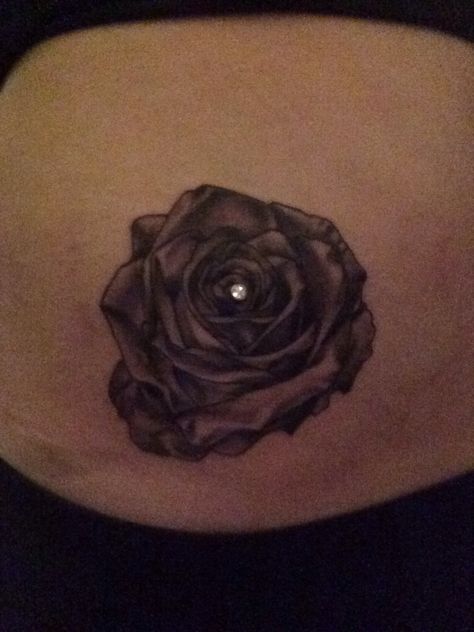 rose tattoo with a dermal in the middle Tattoo With Dermal Piercing, Flower Wrist Tattoos, Dermal Piercing, Rose Tattoo, Wrist Tattoos, Tattoos And Piercings, In The Middle, The Middle, Tatting