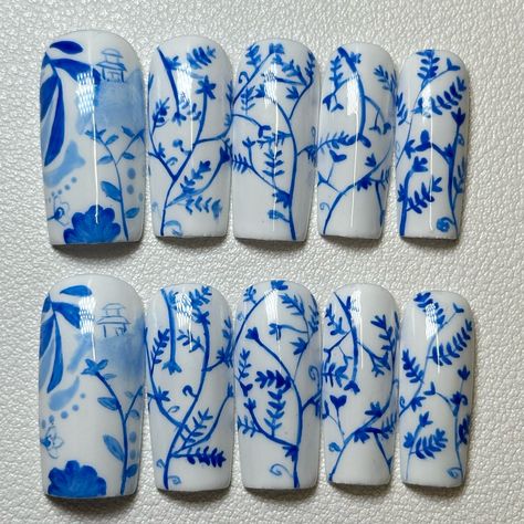 One of the most iconic features that makes you think of China! This set is inspired by the famous deep blue Chinese porcelain paired with a crisp white background. The continuous floral vine design on four fingers pays homage to the often advanced design on Chinese pottery making this set truly one of a kind! Link in bio to order or via dm💙🤍🍚 • • • #nails #nailart #nailsofinstagram #gelnails #beauty #nailsart #nail #nailsdesign #nailartist #naildesigns #nailartist #nailpolish #nailinspo #ins... Blue Porcelain Nails, Porcelain Nails, Four Fingers, Paw Hand, China Nails, Chinese Pottery, Jelly Nails, Blue And White China, Vine Design