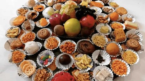 56 individual dishes are offered to Lord Krishna at this festival, but why 56? 56 Bhog Thali, Vegetarian Menu, Bountiful Harvest, Indian Sweets, But Why, Lord Krishna, Vegetable Dishes, Dried Fruit, The Meaning