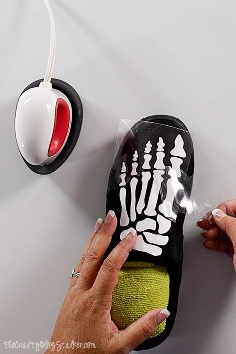 Make a pair of fun skeleton shoes using iron-on vinyl and your Cricut! Click here for a step-by-step tutorial with a video.#thecraftyblogstalker #skeletonshoes #cricut #cricutcreated Cricut On Shoes, Skeleton Shoes Diy, Diy Halloween Shoes, Cricut Shoes Projects, Skeleton Shoes, Skeleton Diy, Wood Burn Spoons, Halloween Shoes, Rhinestone Projects