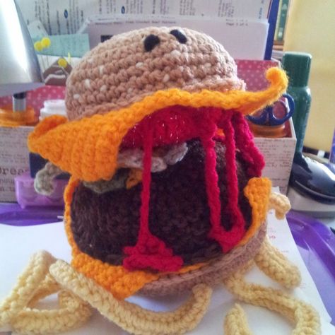 This was a hoot to design and crochet. Crochet designer Robin Crider.  Cheeseburger is designed from"Cloudy with a Chance for Meatballs II" MR Cheeseburger was a special request for a young man who loves the movie.  Crochet using Knit_Picks Brava worsted yarn and "H" crochet hook This took Robin back to her early crochet years.  Crochet should be fun and relaxing. Love it. Movie Crochet, Knit Picks, Wood Ornaments, Crochet Hook, Crochet Animals, Cheeseburger, Meatballs, The Movie, Crochet Hooks