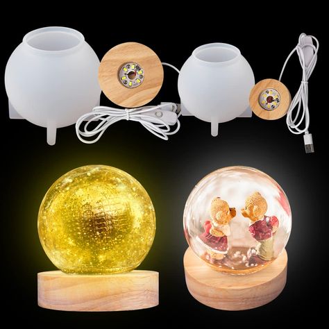 PRICES MAY VARY. 💖Package Incude : 1x 80mm sphere round resin mold+1x 80mm large yellow led light base+1x 65mm sphere round resin mold+1x 60mm white led light base. 💖Size:80mm ball: 3.23*3.07 inch (8.2*7.8cm); 65mm ball: 2.64*2.56 inch (6.7*6.5cm); light base: 80mm: 3.15*0.79 inch (8*2cm); 60mm: 2.36*0.78 inch (6*2cm); the line length is 1.4m. 💖 Diy your own resin lamp : You can make all kinds of beautiful decorative bulbs according to your mood and preferences. You can added some dried flowe Diy Resin Lamp, Flower Sphere, Silicone Molds For Resin, Dandelion Paperweight, Sphere Light, White Fairy Lights, Molds For Resin, Resin Lamp, Ball Lamps