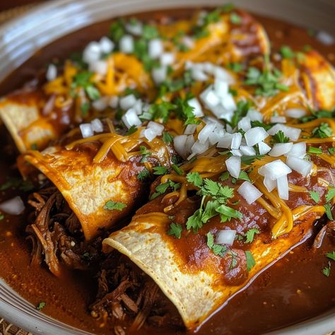 🌯🌶️ Turn up the heat with Birria Enchiladas! Rich, savory, and packed with flavor! #EnchiladaEnthusiast Birria Enchiladas Ingredients: Birria (cooked beef), shredded (2 cups (300 g)) Corn tortillas (10) Enchilada sauce (2 cups (480 ml)) Onion, chopped (1/2 cup (75 g)) Cilantro, chopped (1/4 cup (15 g)) Cheese, shredded (1 cup (100 g)) Instructions: Dip tortillas in warm enchilada sauce. Fill with birria, onions, and cilantro. Roll, place in a baking dish, top with cheese, and bake at 375°... Birria Enchiladas, Enchilada Ingredients, Instagram Recipes, Twisted Recipes, Taco Bar, Food Babe, Trending Recipes, Corn Tortillas, Enchilada Sauce