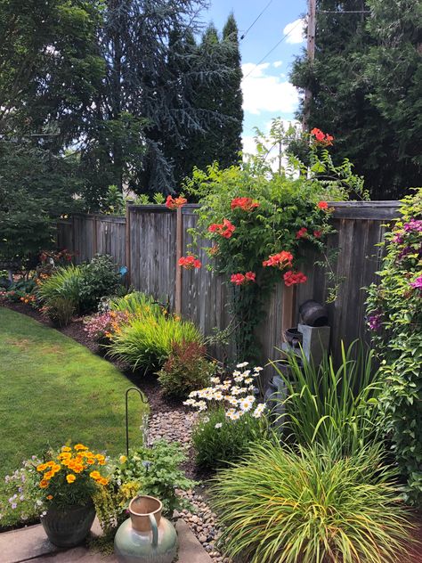 From House Landscaping, Backyard Flowerbed Along Fence, Landscape Ideas Against Fence, How To Train A Passionfruit Vine, Adding Height To Garden, Landscape Around Deck Backyard, Backyard Fence Line Landscaping Ideas, Flowerbed Along Fence, Snapdragon Flowers In Pots