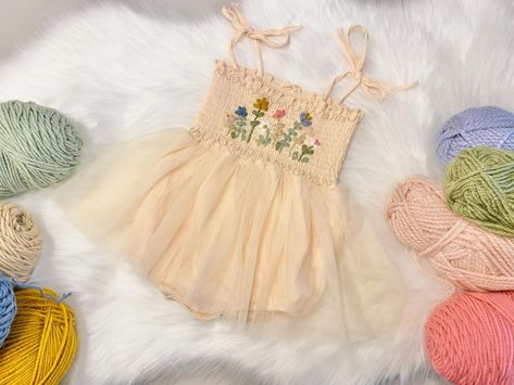 🪻🌼💐NEW Wildflower Rompers🌻🌸🌷 These are sooo fun & are now available in 3 colors!!! Choose any yarn color combos for the flowers to match her flower themed birthday! Shop our Etsy link… #themodmango #themodmangobabyco #wildonebirthday #wildoneflower #wildflowers #wildflowerbirthday #fairyfirstbirthday #secretgarden #secretgardenparty #firstbirthday #firstbirthdayoutfit #1stbirthday #1stbirthdayoutfit #babyboutique #handembroidery Wildflower First Birthday Girl, Wildflower 1st Birthday, Wildflower First Birthday, 1st Birthday Tutu, Boho Wildflower, Purple Romper, 1st Birthday Party Themes, Flower Birthday, First Birthday Outfit