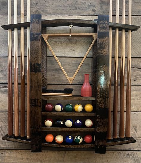 #whiskeybarrel #recroom #whiskeygifts #poolcueholder #whiskeybarrelwood #upcycledfurniture #bourbongifts #whiskeyrack #whiskeybarrelhead #Pingpongcaddie #pingpongpaddle #pingpongtable #gamefurniture #drinkscabinet #cocktailcabinet #liquorshelf #blantonsdisplay #homebarshelves #barshelves #bourbonshelves #blantons #whiskeyrack #rusticwallshelf #poolstick #poolcuerack #poolroom #whiskeybarrelwood #whiskeydecor #poolcueholder #whiskeygifts #barshelves #whiskeyrack #whiskeybarrelhead #8ballpool Bourbon Barrel Furniture, Pool Stick Holder, Game Furniture, Whiskey Rack, Pool Rack, Pool Cue Holder, Bourbon Room, Cave Room, Pool Cue Rack