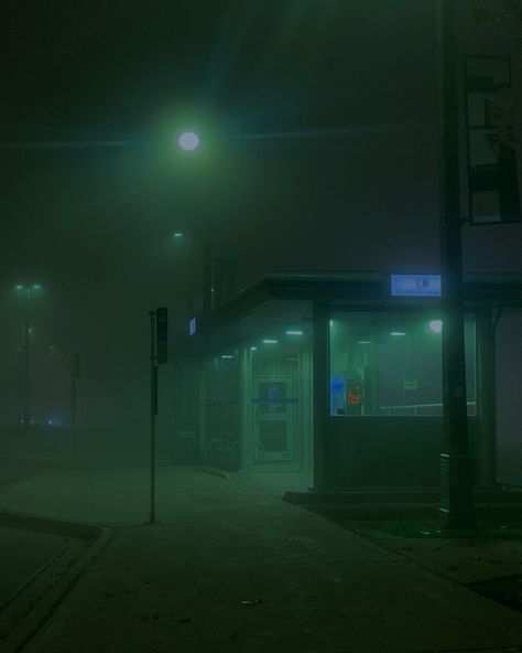 This shows a bus stop that’s lit in an eerie green foggy way. Foggy Nights Aesthetic, Green Foggy Aesthetic, Dark Foggy Aesthetic City, Dark City Photography, Foggy Green Aesthetic, Foggy City Night, Foggy Liminal Space, Foggy Aesthetic City, Foggy City Aesthetic