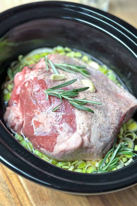 Make a holiday-worthy Crockpot Lamb Roast with this simple recipe. Tender and juicy meat slow-cooked with savory sauce and aromatic herbs. Crockpot Lamb, Roast Crockpot, Simple Crockpot, Lamb Roast, Savory Sauce, Aromatic Herbs, Beef Broth, Simple Recipe, Leeks