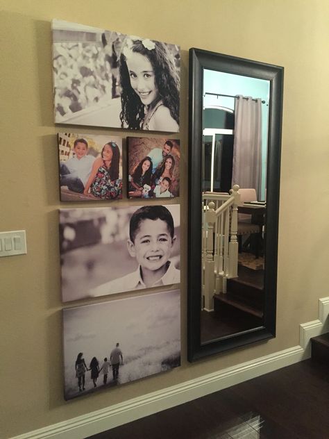 Our family photo wall is complete - canvas prints with large wall mirror. Perfect decor for our large entry wall. Big Mirror And Picture Wall Layout, Mirror Wall Entryway Foyer Ideas, Multiple Mirrors On Wall, Entryway Colors, Family Photo Gallery Wall, Mirror Wall Collage, Wall Mirrors Entryway, Mirror Gallery Wall, Huge Mirror