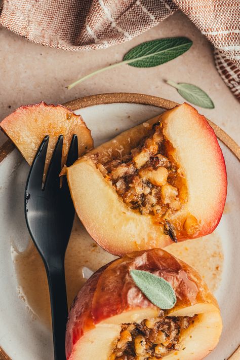 These baked apples are filled with an aromatic mixture of walnuts, sage, and orange zest. This cozy vegan and gluten free dessert is super simple to put together and can be served alongside ice cream or yogurt! Sage Dessert, Paleo Baked Apples, Sage And Orange, Gluten Free Dessert, 2023 Recipes, Paleo Friendly Recipes, Winter Fruit, Healthy Apple, Vegan And Gluten Free