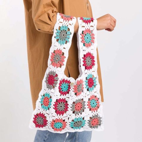 Show off your stitchwork with this granny square tote perfect for the market. All it takes is one simple motif stitched in multiple colorways of Lily Sugar ‘n Cream yarn to create this easy crochet tote that’s totally on trend. This tote kit includes the yarn and easy crochet instructions. This 17 x 12" (43 x 30cm) design requires a US size G-6 (4mm) hook to complete (not included). Imported. • Crochet tote kit includes Lily Sugar ‘n Cream yarn (100% cotton, #4 worsted) and instructions. • Difficulty: Easy crochet. • Finished size measures 17 x 12" (43 x 30cm), not including handles. • Requires US size G-6 (4mm) crochet hook (not included). Lily® Radiant Motifs Tote Crochet Kit Home About Us Feedback Newsletter Contact Us Lily® Radiant Motifs Tote Crochet Kit Product Description Show off y Sugar N Cream Yarn, Tl Yarn Crafts, Tote Crochet, Tote Bag Pattern Free, 4mm Crochet Hook, Easy Crochet Patterns Free, Crochet Abbreviations, Bag Pattern Free, Knitted Afghans