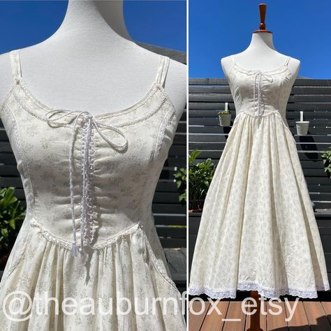 70’s Gunne Sax Egg Shell Floral Midi Sundress with Hidden Butterflies Bust 34”; waist 27.5”; length 43”. #gunnesax #gunnesaxdress #gunnesaxforsale #vintageprairiedress #vintagesundress Shell Background, Sage Green Leaves, Vintage Sundress, Vintage Prairie Dress, Gunne Sax Dress, 70s Outfits, Midi Sundress, Cottagecore Fashion, Egg Shell