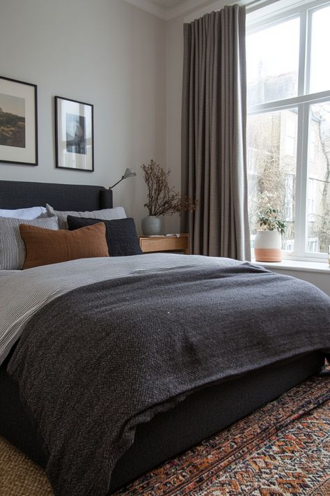 Create a romantic, neutral bedroom with these tips on how to style a gray bedroom. Dark Grey Fabric Headboard Bedroom Ideas, Grey Headboard Brown Furniture, Bedding With Dark Sheets, Grey Vintage Bedroom, Black Gray Tan Bedroom, Bedding With Dark Grey Headboard, Dark Grey Bed Decor, Grey Bed Styling Ideas, Grey Backboard Bedroom