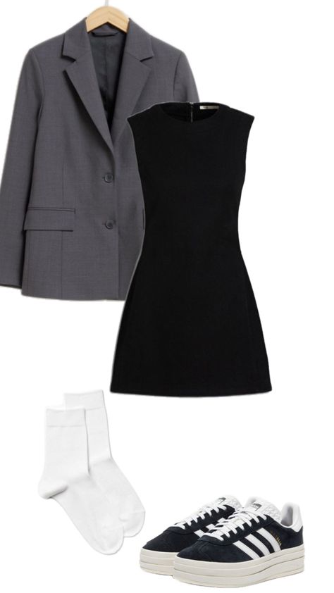 Master the art of blending business and casual with this chic outfit idea. A tailored grey blazer over a classic little black dress brings a professional touch, while the white socks and trendy black Adidas sneakers give it a sporty edge. Perfect for transitioning from office meetings to after-work plans, this look offers both comfort and sophistication. #BusinessCasual #StreetStyle #AdidasSneakers #OfficeFashion #BlazerStyle #PinterestOutfit #FashionInspo #ChicAndComfy Black Adidas Sneakers, Adidas Sneakers Outfit, Classic Little Black Dress, White Socks, Grey Blazer, Pinterest Outfits, Chic Outfit, Sneakers Outfit, Blazer Fashion