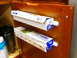 Forget about storing things like rolls of aluminum foil in a drawer. Mount them inside your cabinet for easier access and to save on valuable storage space. Aluminum Foil Storage, Kitchen Wrap, Plastic Baskets, Command Hooks, Edging Ideas, Cling Wrap, Kitchen Drawers, Plastic Hooks, Plastic Wrap