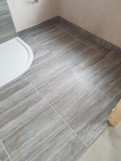 Using the same tiles for the floor, shower area and upstand around the edges gives a seamless finish to this bathroom tiling. #bathroomtilingbristol #bristoltiler #reliabltilerbristol Tiles Skirting, Tile Skirting, Bathroom Tiling, Shower Area, Skirting Boards, Hexagon Tiles, Kitchen Floor Tile, Bathroom Floor Tiles, Bathroom Floor