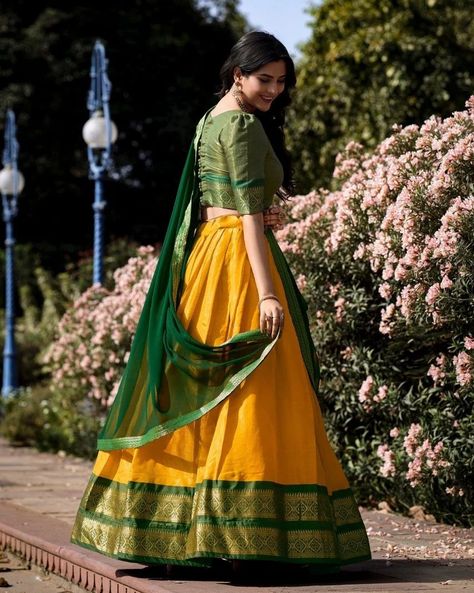 "Experience the epitome of South Indian heritage with our exquisite Kanchipuram silk lehenga, meticulously crafted with love and adorned with timeless tradition. A masterpiece that weaves together art, culture, and elegance. #weareffortlessly #KanchipuramSilk #SouthIndianHeritage #LehengaMasterpiece #ArtMeetsFashion #CulturalElegance #TraditionalChic #SilkLove #HeritageWear" Catalogue : KASHVI Lehenga(Stitched) Lehenga Fabric : Kanchipuram Lehenga Work : Zari Weaving Work Lehenga Waist : ... Davani Half Saree Kerala, Half Saree Models Latest, Half Saree Designs South Indian, Kanchipuram Lehenga, Pattu Lehenga Half Saree, Mehendi Outfit, Lehenga Crop Top, Model Blouse, Lehenga Choli Wedding