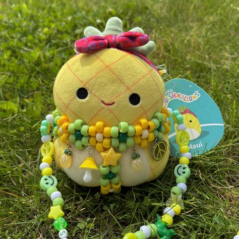 5" pineapple squishmallow comes with a matching kandi harness necklace so you can dance the night away with your lil rave buddy