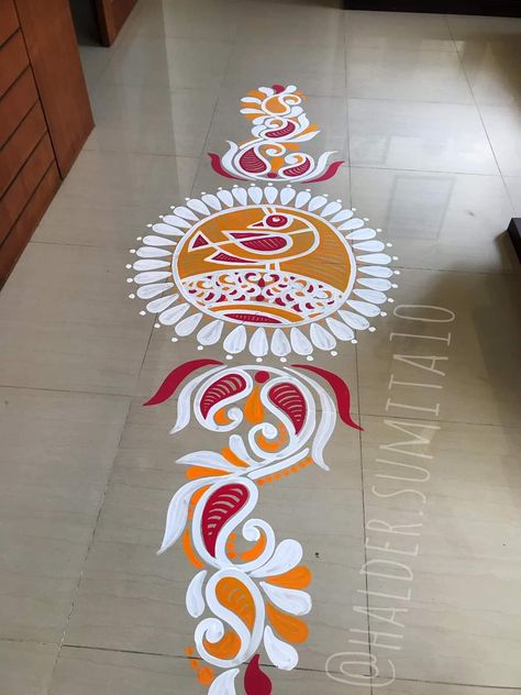 Aipan Art Design For Door, Rangoli For Durga Puja, Alpona Colourful, Alpona Design Bengali Wedding, Painted Rangoli On Floor, Alpona Design Colourful, Rangoli With Paints On Floor, Oil Paint Rangoli Designs On Floor, Colourful Alpona