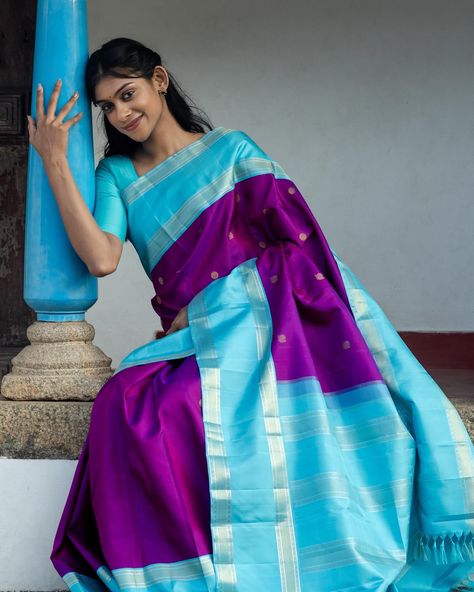 நவநாகரீக பட்டு In the realm of fashion, what’s more modern than traditional? With Kanjeevaram sarees, it’s all about infusing age-old elegance with contemporary flair. Modern Kanjeevaram sarees are more about embracing the legacy of the weave itself. This Purple Kanjeevaram silk saree has a Rettai Pett light blue border embellished with zari work. [Modern Silk, Iruthalai Pakshi, Tulsi Weaves, Silk Saree, Saree, Silk, Handloom Saree, Handloom, Traditional, Vintage, Borderless, Kanchipuram ... Borderless Silk Saree, Kanjeevaram Silk Saree, Kanjeevaram Sarees, Saree Silk, Saree Handloom, Blue Border, Zari Work, Handloom Saree, Silk Saree