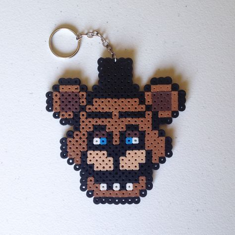 Freddy Fazbear, from the hit video game series Five Nights at Freddy's (FNAF) made from Perler Beads. Inspired by Retr8bit on DeviantArt (http://retr8bit.deviantart.com/art/Five-Nights-At-Freddy-s-Animatronics-Set-1-514146186) Five Nights At Freddy's Freddy, Modele Pixel Art, Easy Perler Beads Ideas, Fuse Bead Patterns, Art Perle, Hama Beads Design, Perler Bead Templates, Diy Perler Bead Crafts, Perler Crafts