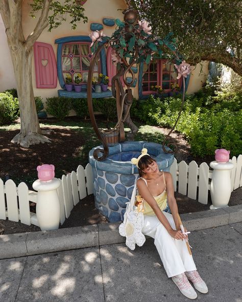 disneyland on digital 🍯🧸🎀 lately obsessed with all the winnie the pooh merch 🥹 paired perfectly with the bow jeans from @edikted and the meadow top from @rumored_ 💛 all photos taken with sony rx100 vii #disneylandcalifornia #winniethepooh #disneystyle #digitalcamera #disneygram Disneyland Family Pictures Ideas, Halloween Disney Fits, Winnie The Pooh Outfit Ideas, Disney Graduation Photos, Cute Disney Photos, Disneyworld Aesthetic Pics, Disney World Aesthetic Pictures, Winnie The Pooh Disney Outfits, Disneyland Poses Ideas