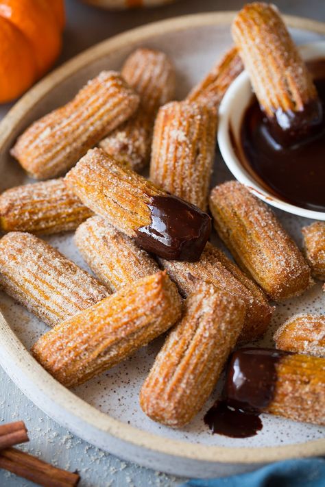 These BakedPumpkin Churros are one of the BEST fall treats! Crisp on the outside, soft and moist on the inside and coated with plenty of cinnamon sugar. Amazing Thanksgiving Desserts, Baked Stuffed Apples, Caramel Dipping Sauce, Easy Thanksgiving Dessert Recipes, Churro Bites, Salty Caramel, Churros Recipe, Thanksgiving Desserts Easy, Toffee Sauce