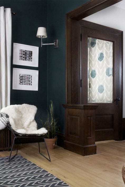 Dark Blue Walls With Wood Trim, Wood Trim Dark Walls, Hauge Blue Living Rooms, Dark Wood Trim Paint Colors, Dark Stained Trim Interior, Best Paint Colors With Dark Wood Trim, Dark Trim Interior, Wood Trim Living Room, Dark Woodwork