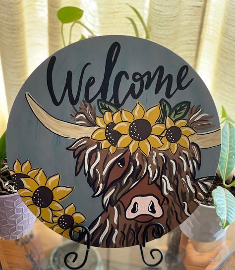 Highland Cow, Welcome Door Hanger, Wall Decor, Farmhouse Decor, Highland Cow Sign, Country Decor, Hand Painted, Sunflowers, Rustic 

This adorable highland cow welcome sign will be a perfect addition to your front door, wall or just placed on an easel for a beautiful decorative display.

All my door/wall hangers are hand painted by me and sealed with a protective sealer to help protect from weather and fading from the sun. Highland Cow Wood Sign, Highland Cow Door Hanger Wooden, Highland Cow Sign, Hand Painted Door Hangers, Highland Cow Door Hanger, Cow Signs, Cow Welcome Sign, Bee Door Hanger, Cow Door Hanger