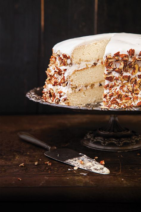 From SAVEUR Issue #168 A traditional Southern confection, this regal dessert gained popularity through writer Owen Wister’s 1906 romance novel, Lady Baltimore. Three dreamy white layers of cake are infused with rose water and slathered with an Italian meringue frosting studded with pecans, raisins, dried figs, and candied orange peel. Italian Meringue Frosting, Lady Baltimore Cake, Saveur Recipes, Strawberry Lemon Cake, Meringue Frosting, Candied Orange, Southern Desserts, Italian Meringue, Layer Cake Recipes